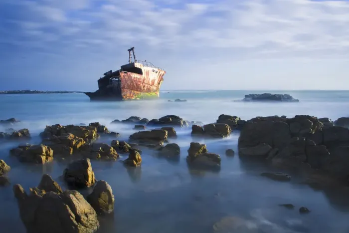 Framed Print : Old shipwreck long exposure on the rocks at sunset - Cape L Agulus South Africa Framed Print : Old shipwreck long exposure on the rocks at sunset - Cape L Agulus South Africa