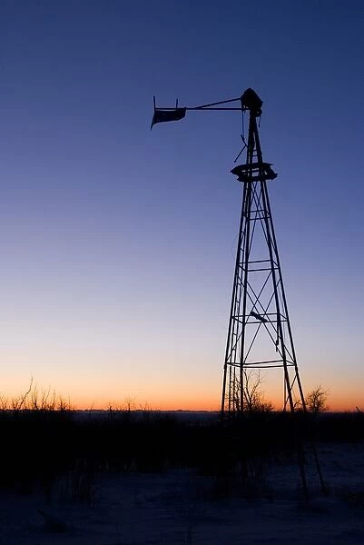 Old wind mill at sunset