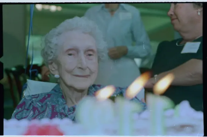 Framed Print : Old Woman Observing Birthday Candles Framed Print : Old Woman Observing Birthday Candles
