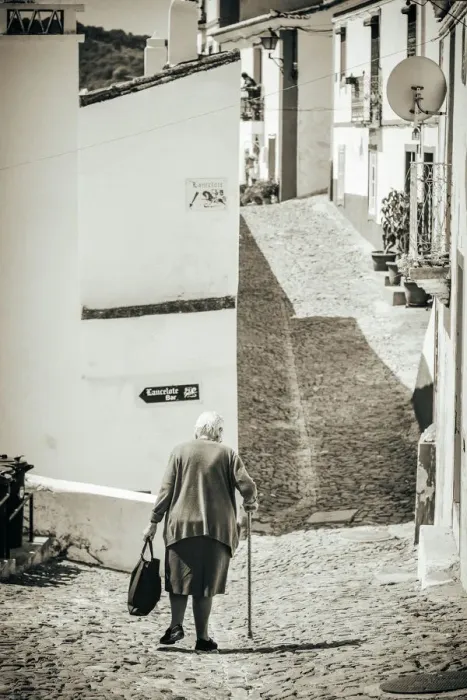 Framed Print : Old woman walks in the road Framed Print : Old woman walks in the road