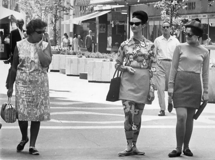 Framed Print : Older Woman Stares at Women's Skirts Framed Print : Older Woman Stares at Women's Skirts