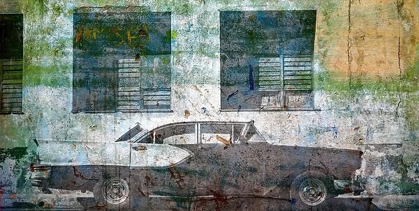 Oldsmobile on a weathered wall in Havana