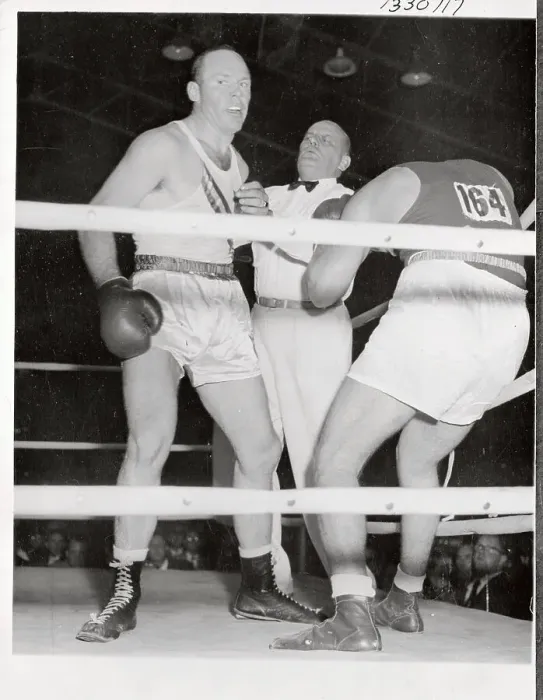 Framed Print : Olympic Boxer T.P. Rademacher Punching Opponent