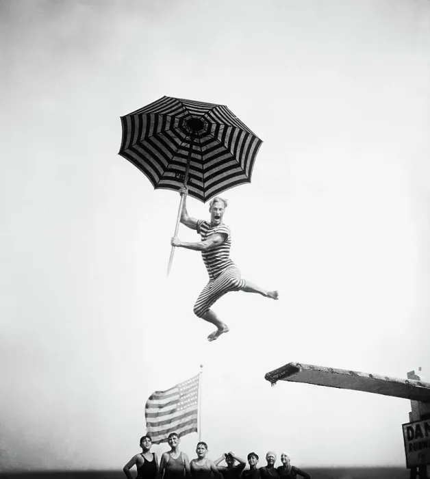 Framed Print : Olympic Swimmer Doing Comic Diving Stunt
