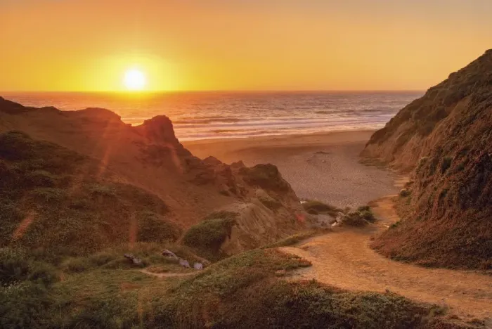 Framed Print : Orange california sunset on the ocean with trail down to a beach Framed Print : Orange california sunset on the ocean with trail down to a beach