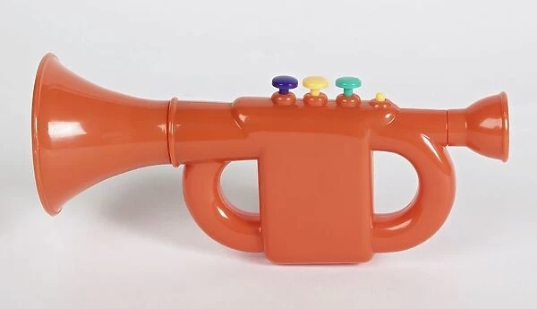 Orange plastic trumpet, side view