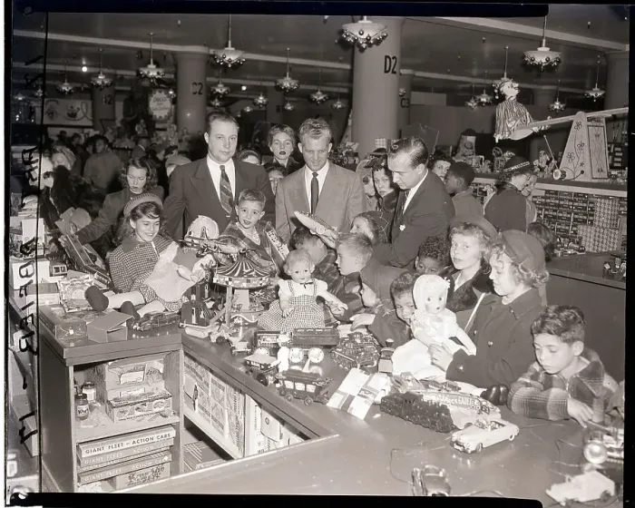 Framed Print : Orphans at Gimbels Touch Doll at Counter