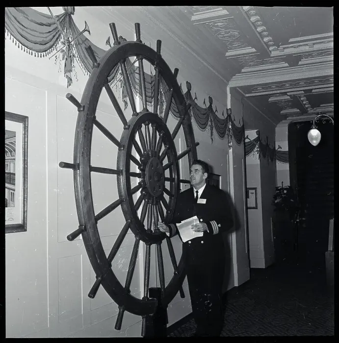 Framed Print : Otto Graham Admiring Ship Wheel on Wall Framed Print : Otto Graham Admiring Ship Wheel on Wall
