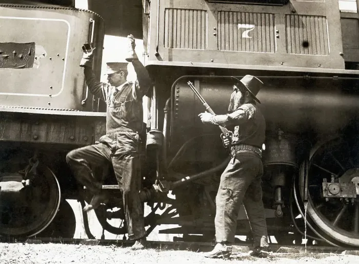 Framed Print : Outlaw Holds Rifle To Train Engineer
