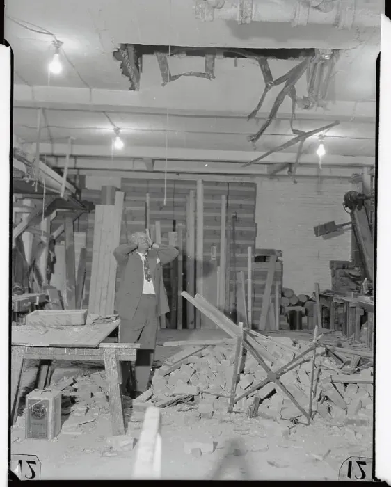 Framed Print : Owner Standing in Ruins of Store