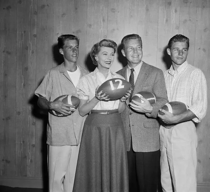 : Ozzie Nelson and Family Holding Footballs : Ozzie Nelson and Family Holding Footballs
