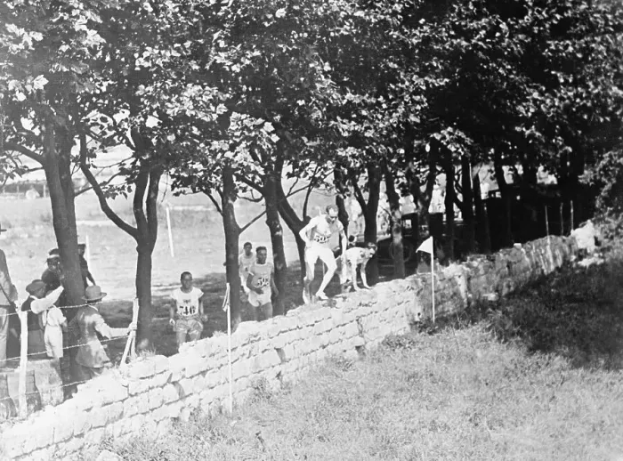 Framed Print : Paavo Nurmi Crosses Wall in Race