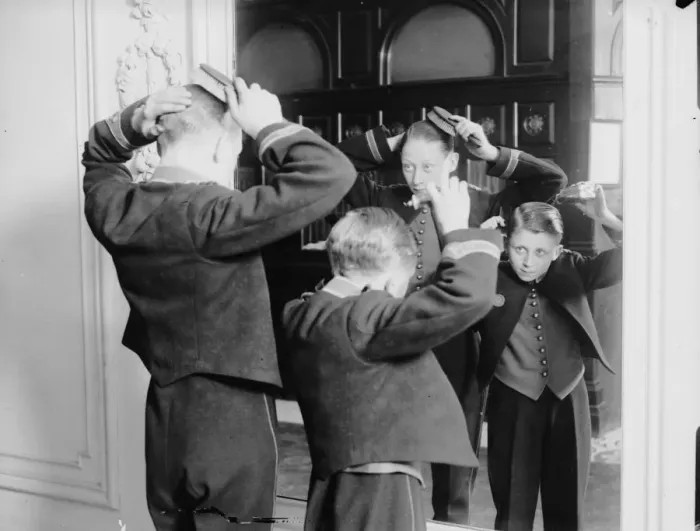 Framed Print : Page Boys. Page boys at Hotel Cecil prepare for an inspection