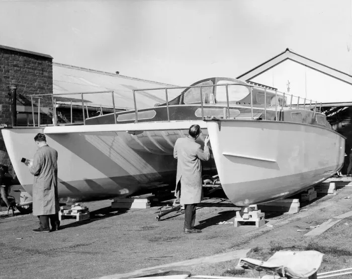 Framed Print : Painting A Catamaran Framed Print : Painting A Catamaran