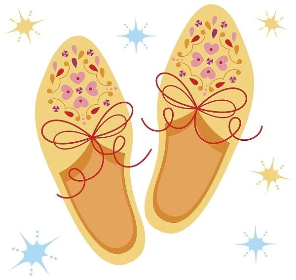 Pair of yellow shoes decorated with pink floral pattern