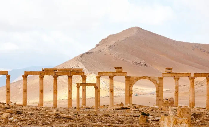 Framed Print : Palmyra arches against desert dunes Framed Print : Palmyra arches against desert dunes