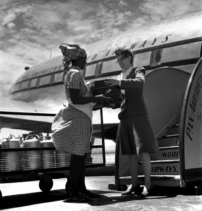 Framed Print : Pan Am. PORT-AU-PRINCE, HAITI - CIRCA 1947: An airport worker hands boxes Framed Print : Pan Am. PORT-AU-PRINCE, HAITI - CIRCA 1947: An airport worker hands boxes