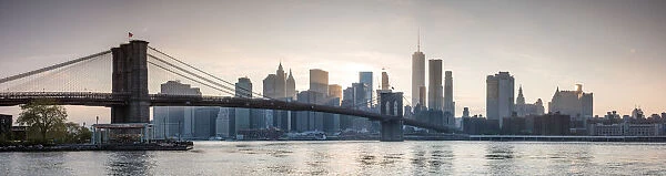 Panoramic: Brooklyn bridge and Manhattan at sunset, New York city