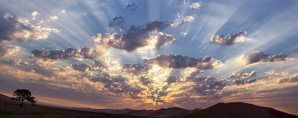 Panoramic of God beams over desert at sunset, Namib-Naukluft Park, Namibia