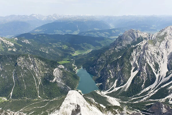 Panoramic view of the Alps from the peak of Mt Seekofel towards the north with Pragser Wildsee Lake, Dolomiti di Braies, South Tyrol province, Trentino-Alto Adige, Italy