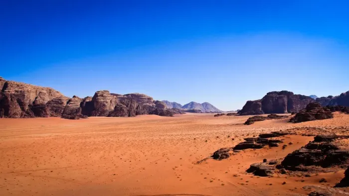 Framed Print : Panoramic view of Wadi Rum with clear blue sky background and some rock boulders Framed Print : Panoramic view of Wadi Rum with clear blue sky background and some rock boulders