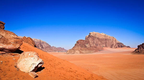 Panoramic view of Wadi Rum with sand dunes in forefront