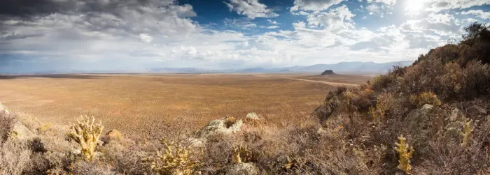 Framed Print : Panoramic views over the Tankwa Karoo Desert with dramatic thunderclouds in the sky Framed Print : Panoramic views over the Tankwa Karoo Desert with dramatic thunderclouds in the sky