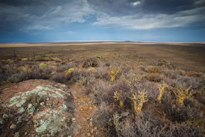 Framed Print : Panoramic views over the Tankwa Karoo Desert with dramatic thunderclouds in the sky Framed Print : Panoramic views over the Tankwa Karoo Desert with dramatic thunderclouds in the sky