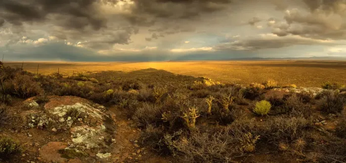 Framed Print : Panoramic views over the Tankwa Karoo Desert with dramatic thunderclouds in the sky Framed Print : Panoramic views over the Tankwa Karoo Desert with dramatic thunderclouds in the sky