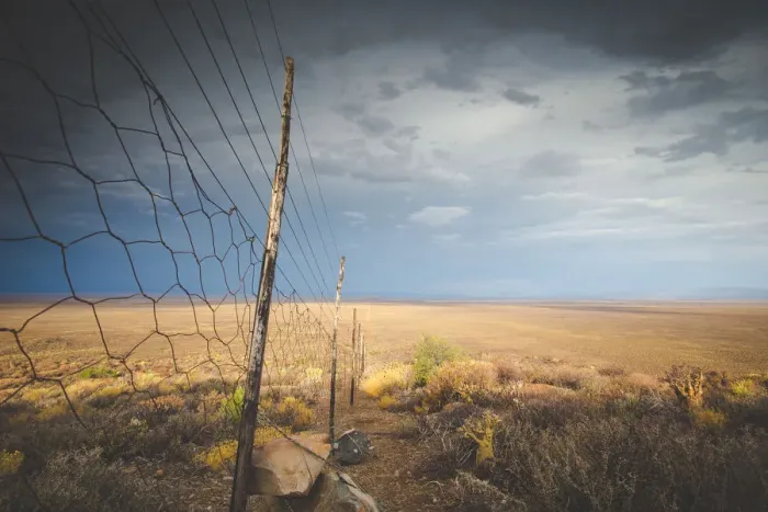 Framed Print : Panoramic views over the Tankwa Karoo Desert with dramatic thunderclouds in the sky