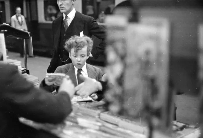 Framed Print : Paper Boy. 8th October 1938: A boy at a newspaper stand on a railway station Framed Print : Paper Boy. 8th October 1938: A boy at a newspaper stand on a railway station