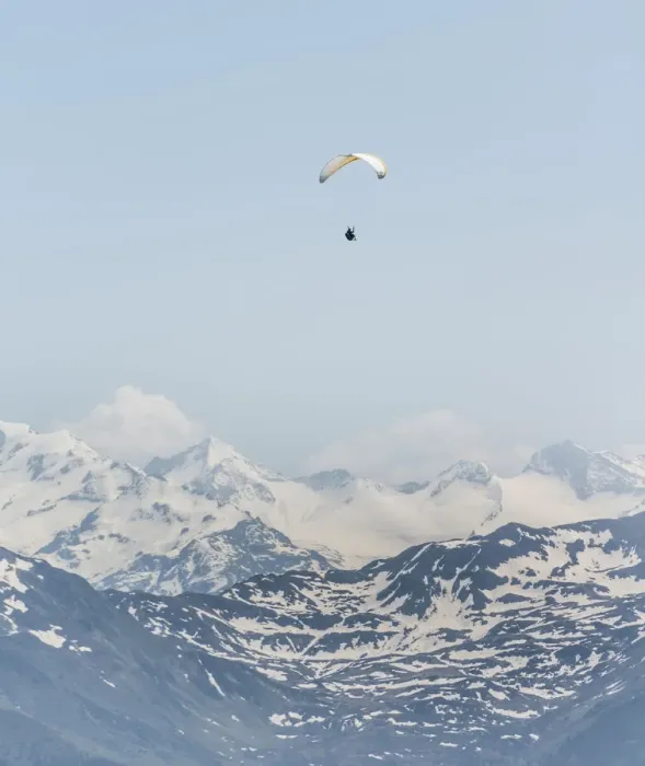 Framed Print : Paraglider against a blue sky, snow-capped peaks of the Alps at the back Framed Print : Paraglider against a blue sky, snow-capped peaks of the Alps at the back