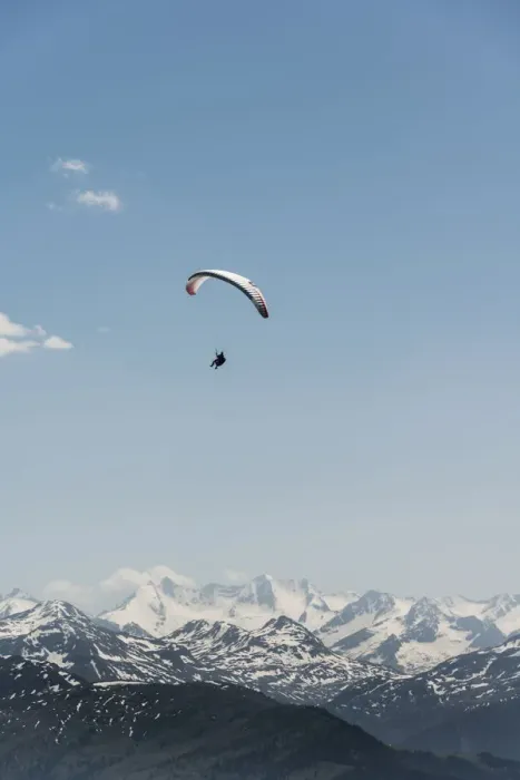 Framed Print : Paraglider against a blue sky, snow-capped peaks of the Alps at the back Framed Print : Paraglider against a blue sky, snow-capped peaks of the Alps at the back