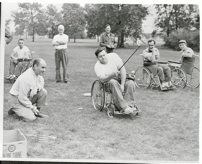 Framed Print : Paraplegics Instructor Teaching Golf Skills from His Chair Framed Print : Paraplegics Instructor Teaching Golf Skills from His Chair