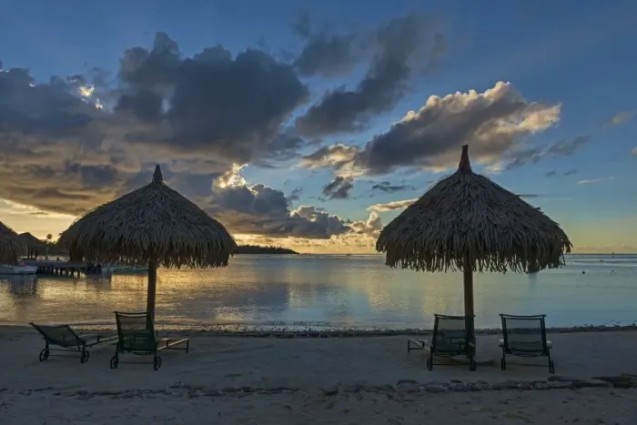 Framed Print : Parasols and sun loungers on the beach, evening atmosphere, Moorea, French Polynesia Framed Print : Parasols and sun loungers on the beach, evening atmosphere, Moorea, French Polynesia