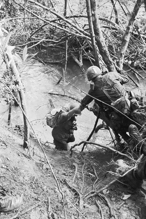 Framed Print : Paratrooper Helping Fellow Soldier