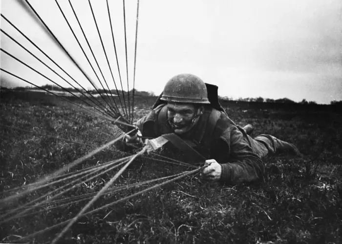 Framed Print : Paratrooper Lands Framed Print : Paratrooper Lands