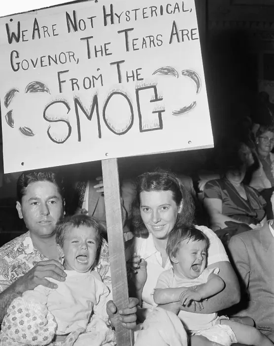 Framed Print : Parents with Crying Children Protesting Smog