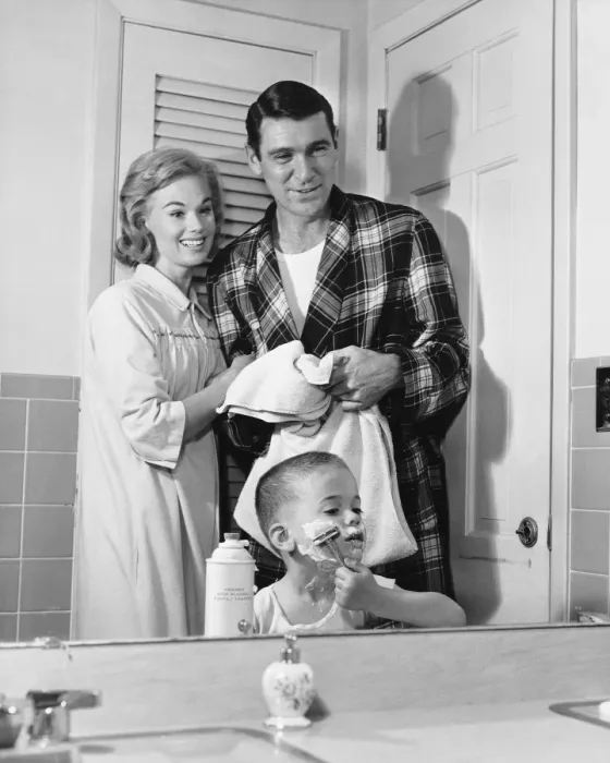 Framed Print : Parents watching as son pretends to shave Framed Print : Parents watching as son pretends to shave
