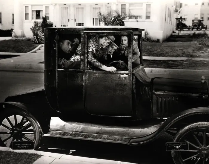 Framed Print : Passengers Packed in Old Car Framed Print : Passengers Packed in Old Car