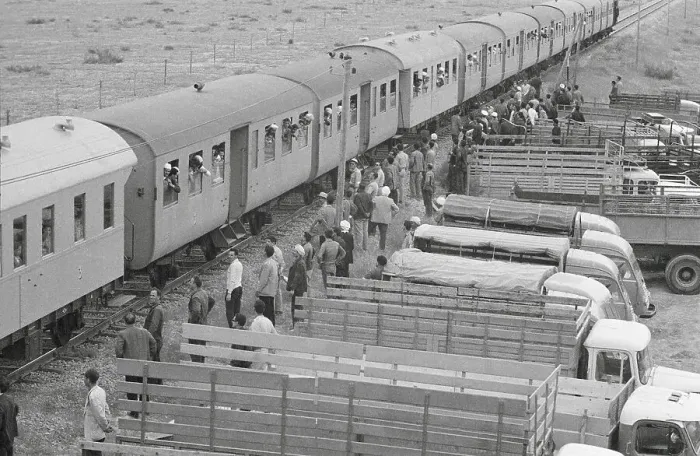 Framed Print : Passengers and Transport Trucks at Train Station Framed Print : Passengers and Transport Trucks at Train Station