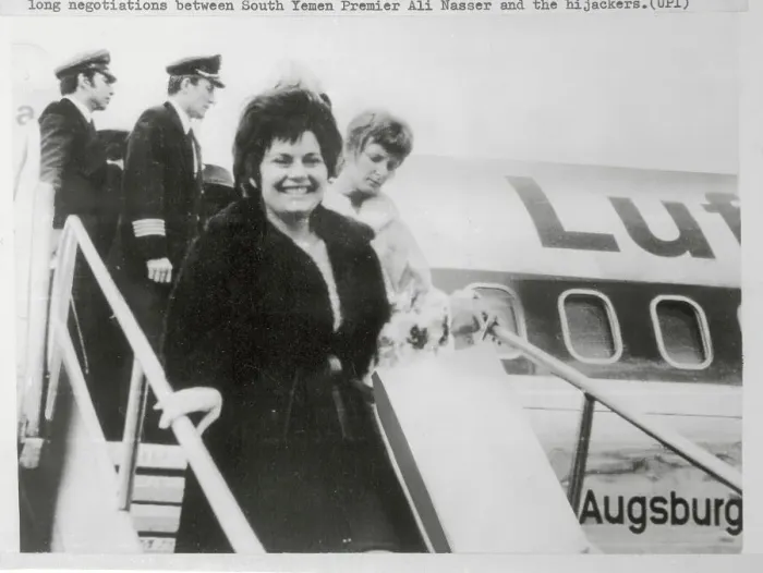 Framed Print : Passengers Walking out of Airplane