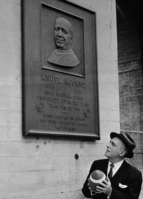 Framed Print : Pat O'Brien Holding Football and Looking at Wall Plaque Framed Print : Pat O'Brien Holding Football and Looking at Wall Plaque