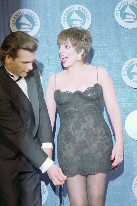 Framed Print : Patrick Swayze Tugging Liza Minnelli's Dress Framed Print : Patrick Swayze Tugging Liza Minnelli's Dress
