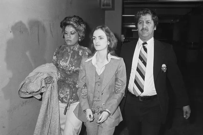 Framed Print : Patty Hearst Being Escorted in Handcuffs Framed Print : Patty Hearst Being Escorted in Handcuffs