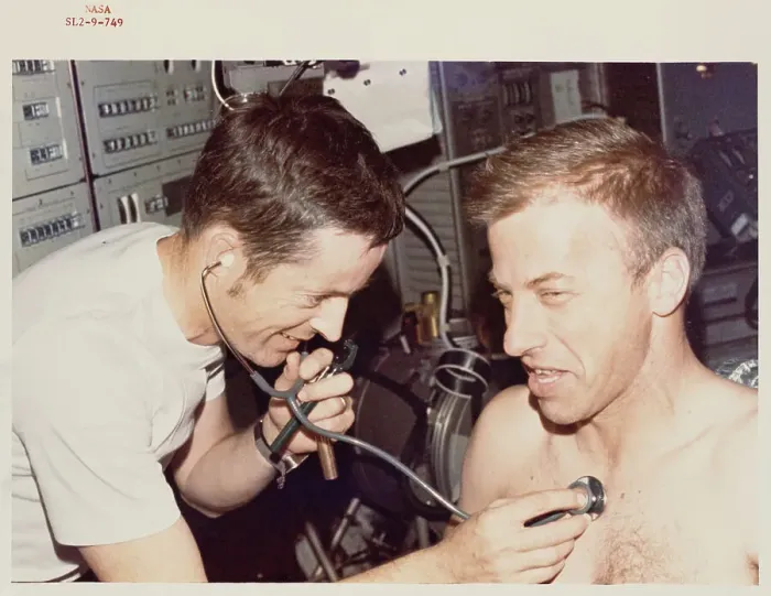 Framed Print : Paul J Weitz, Skylab II pilot, gets a physical examination Framed Print : Paul J Weitz, Skylab II pilot, gets a physical examination
