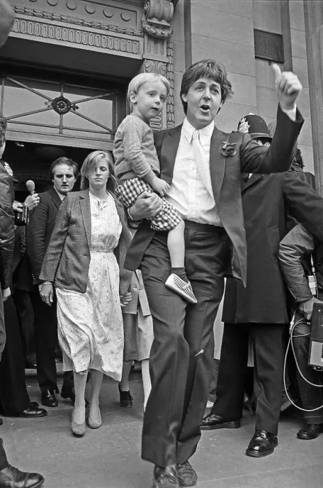 Framed Print : Paul McCartney Carrying Child Framed Print : Paul McCartney Carrying Child