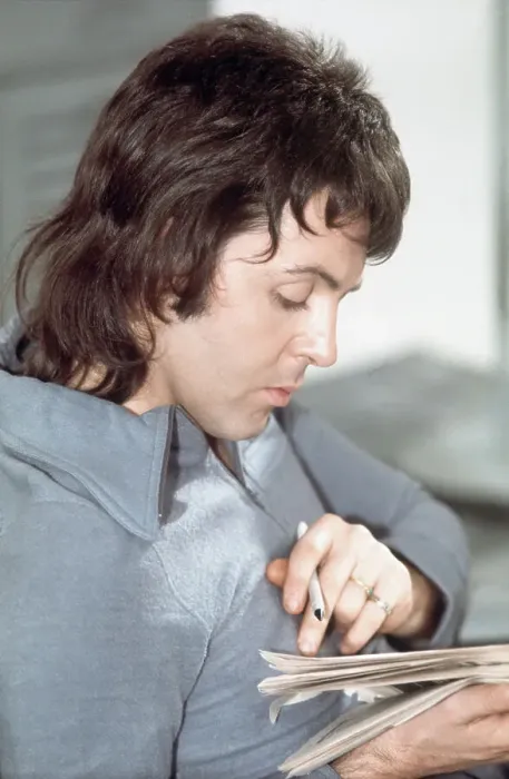 Framed Print : Paul McCartney Seated and Reading Framed Print : Paul McCartney Seated and Reading