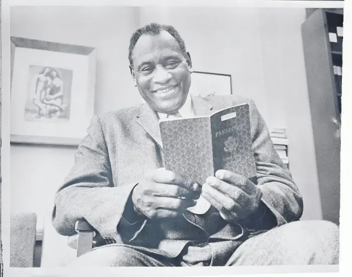Framed Print : Paul Robeson Examining His Passport