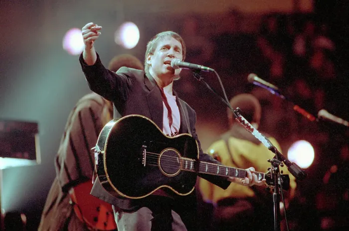 Framed Print : Paul Simon Singing on Stage